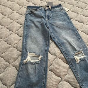 Size 7 waist 27 length 31: blue jeans with knee cut outs; slits at ankles